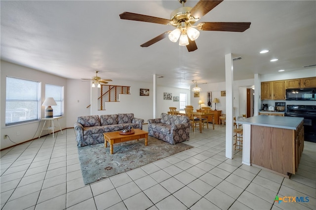 323 E Klein Rd, New Braunfels, TX 78130 - tiled living room with ceiling fan