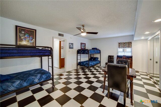 323 E Klein Rd, New Braunfels, TX 78130 - bedroom with ceiling fan and a textured ceiling