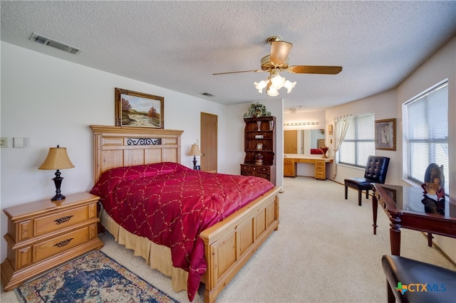 323 E Klein Rd, New Braunfels, TX 78130 - carpeted bedroom featuring ceiling fan and a textured ceiling