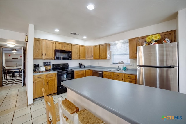 323 E Klein Rd, New Braunfels, TX 78130 - kitchen with light tile patterned flooring, sink, and black appliances