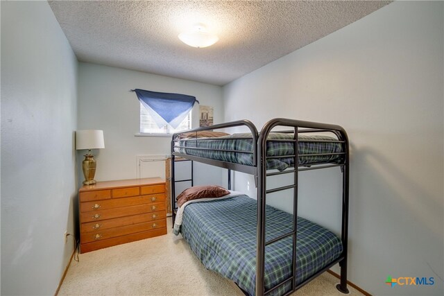 323 E Klein Rd, New Braunfels, TX 78130 - bedroom with carpet flooring and a textured ceiling