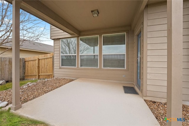 view of patio featuring fence