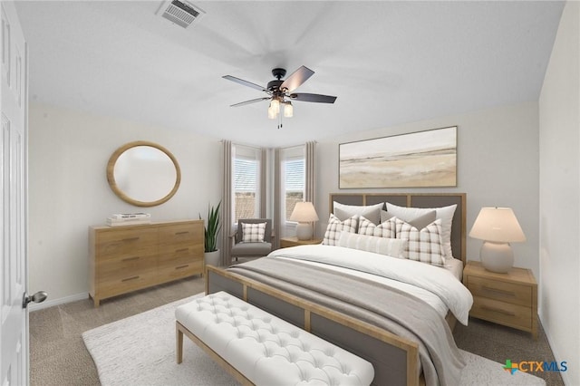 bedroom featuring visible vents, baseboards, ceiling fan, and carpet flooring