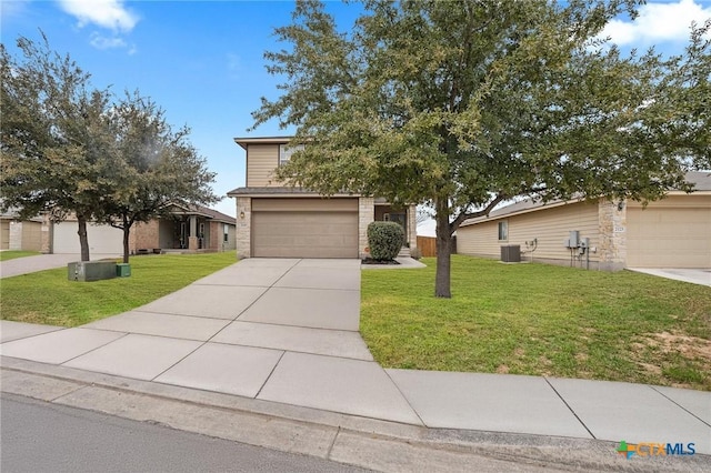 view of property hidden behind natural elements featuring an attached garage, central AC unit, concrete driveway, and a front lawn