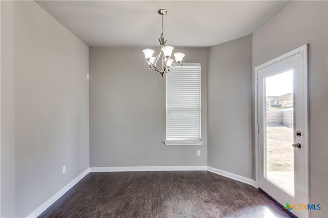 1202 Jester Ct, Copperas Cove, TX 76522 - spare room with a chandelier and dark wood finished floors