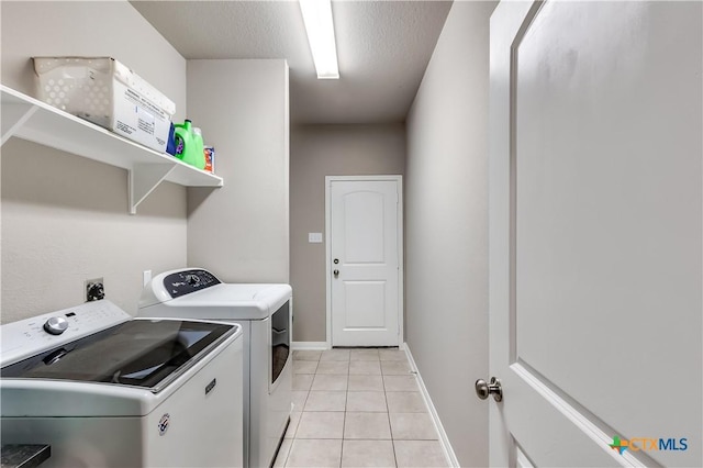 1202 Jester Ct, Copperas Cove, TX 76522 - laundry room with washing machine and clothes dryer and light tile patterned flooring