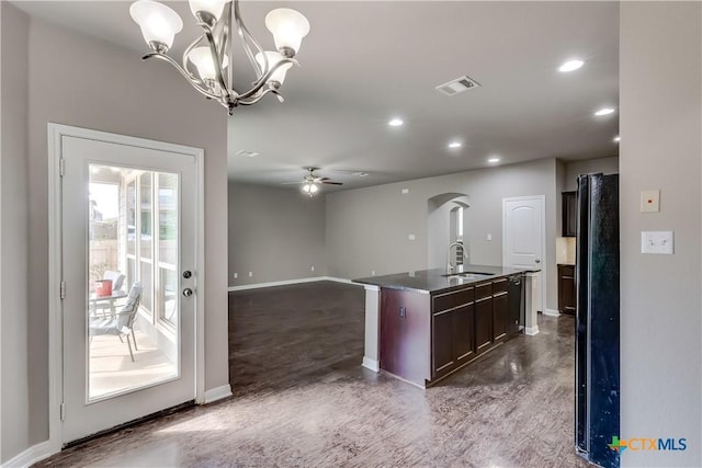 1202 Jester Ct, Copperas Cove, TX 76522 - kitchen with dark countertops, arched walkways, recessed lighting, a ceiling fan, and an island with sink