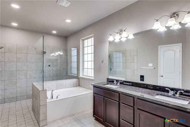 1202 Jester Ct, Copperas Cove, TX 76522 - bathroom with a bath, a walk in shower, double vanity, tile patterned floors, and recessed lighting