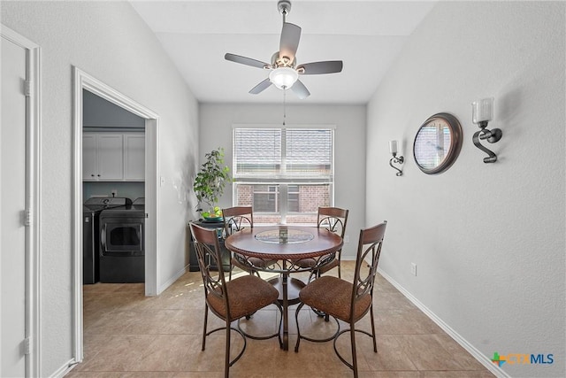 tiled dining area featuring ceiling fan and washer and clothes dryer