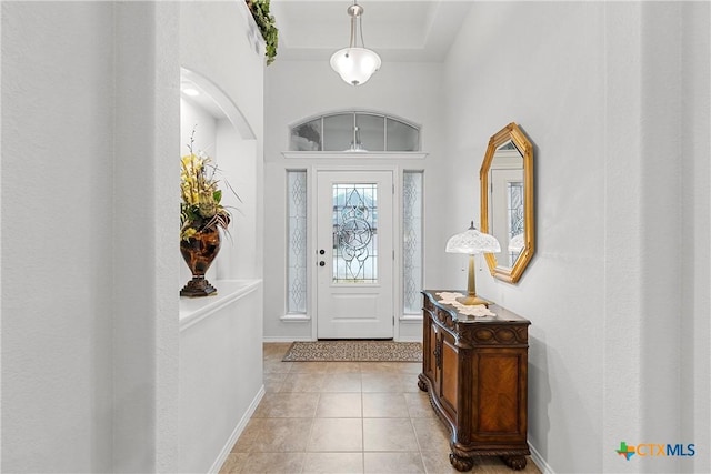 entrance foyer featuring light tile patterned floors