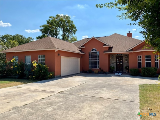 single story home featuring a garage