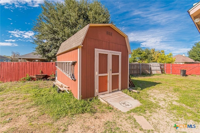 view of outbuilding with a yard