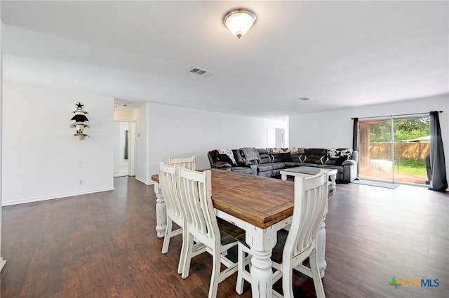 7410 Tom Watson Ct, San Antonio, TX 78244 - dining area featuring dark wood-type flooring and baseboards