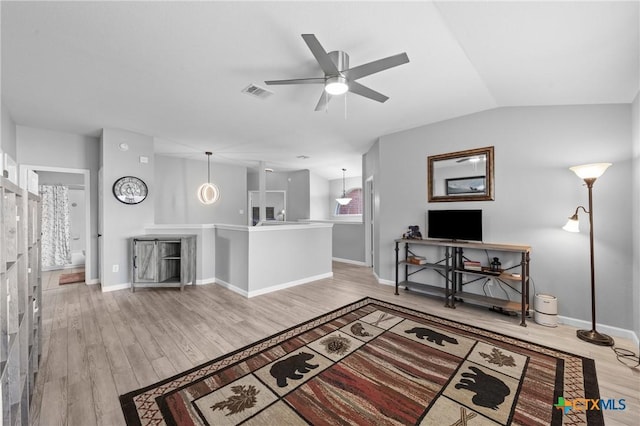 4904 Sodalite Ct, Killeen, TX 76542 - living room with wood finished floors, a ceiling fan, baseboards, and vaulted ceiling