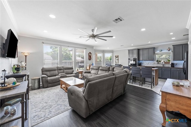 4904 Sodalite Ct, Killeen, TX 76542 - living room with ornamental molding, a ceiling fan, recessed lighting, and dark wood-style floors
