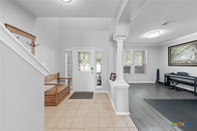 4904 Sodalite Ct, Killeen, TX 76542 - foyer featuring decorative columns, light tile patterned flooring, baseboards, and crown molding