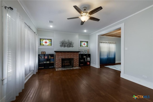 721 W Kings Hwy, San Antonio, TX 78212 - unfurnished living room with ornamental molding, wood finished floors, a ceiling fan, a brick fireplace, and baseboards