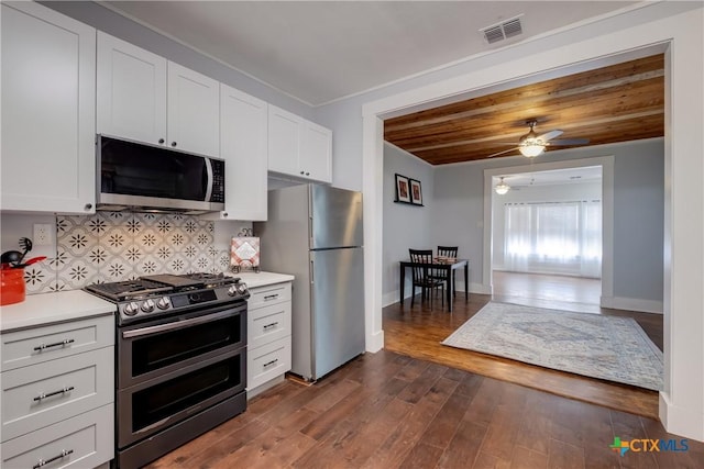 721 W Kings Hwy, San Antonio, TX 78212 - kitchen featuring appliances with stainless steel finishes, light countertops, a ceiling fan, white cabinetry, and dark wood-style flooring
