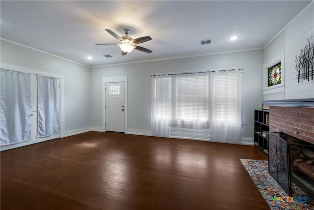 721 W Kings Hwy, San Antonio, TX 78212 - unfurnished living room with wood finished floors, ceiling fan, a brick fireplace, ornamental molding, and baseboards