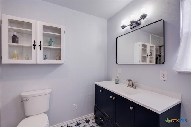 721 W Kings Hwy, San Antonio, TX 78212 - bathroom with vanity, toilet, and baseboards