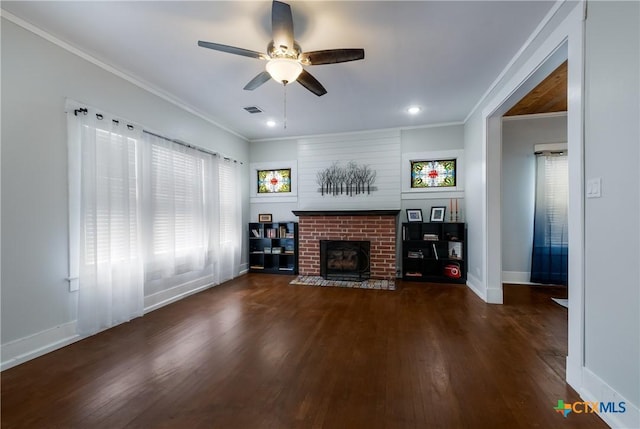 721 W Kings Hwy, San Antonio, TX 78212 - unfurnished living room with crown molding, wood finished floors, a ceiling fan, a fireplace, and baseboards