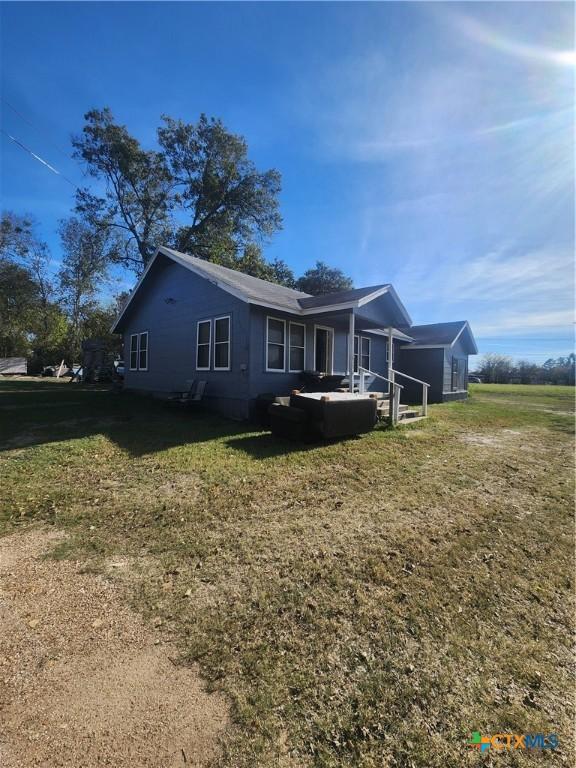 view of front of home with a front yard