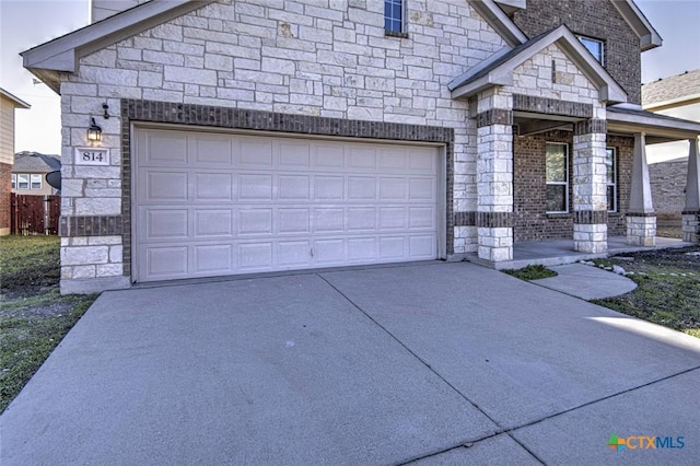 view of front of house featuring a garage and covered porch