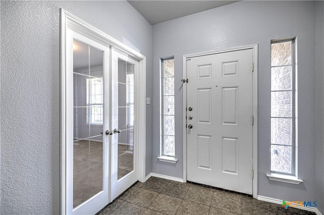 entrance foyer featuring french doors