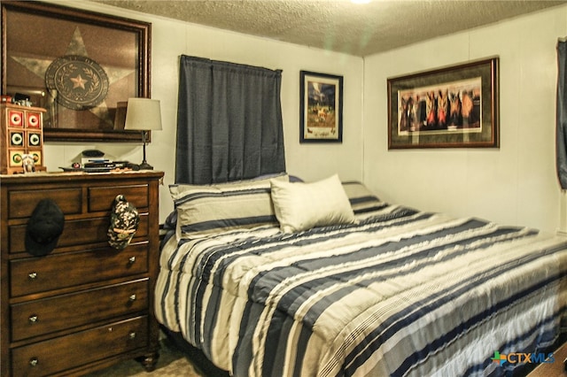 bedroom featuring a textured ceiling