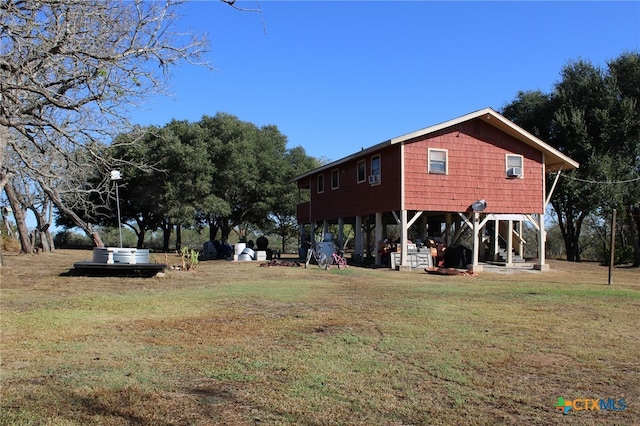 exterior space featuring a yard and a carport