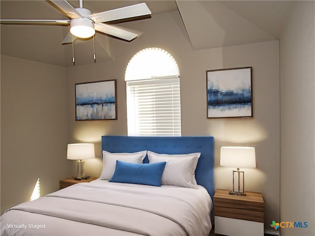 bedroom with ceiling fan and lofted ceiling