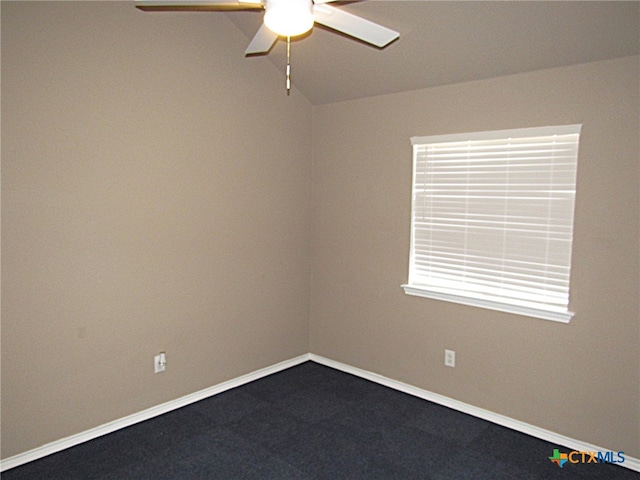 carpeted empty room with a wealth of natural light and ceiling fan