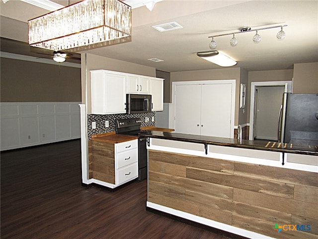 kitchen featuring dark hardwood / wood-style flooring, backsplash, stainless steel appliances, white cabinetry, and butcher block counters