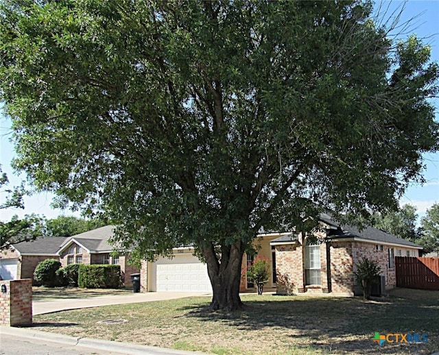 obstructed view of property featuring a garage