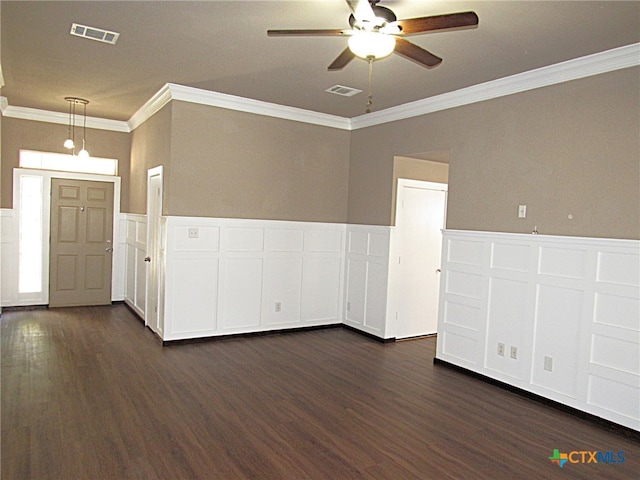 spare room with ceiling fan, dark hardwood / wood-style flooring, and crown molding