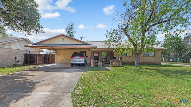 single story home featuring concrete driveway, an attached carport, metal roof, a front yard, and fence
