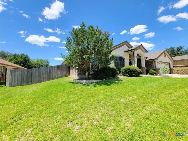 6409 Jovana Dr, Killeen, TX 76542 - view of front facade featuring a garage and stone siding