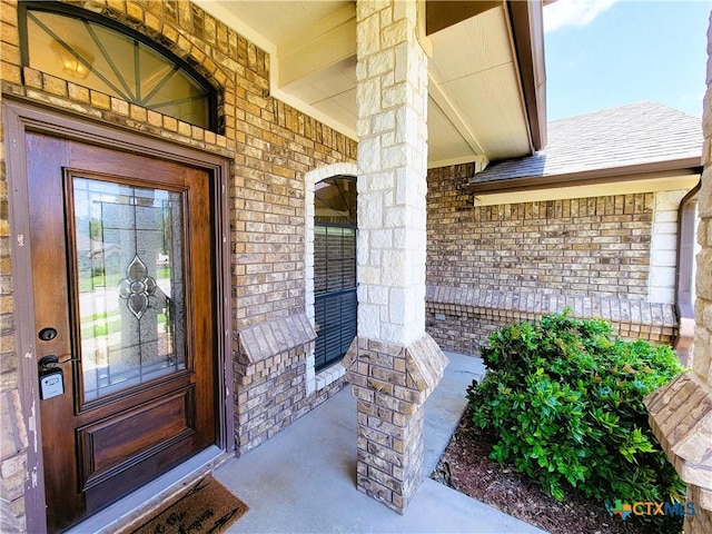 6409 Jovana Dr, Killeen, TX 76542 - doorway to property featuring a porch, brick siding, and stone siding