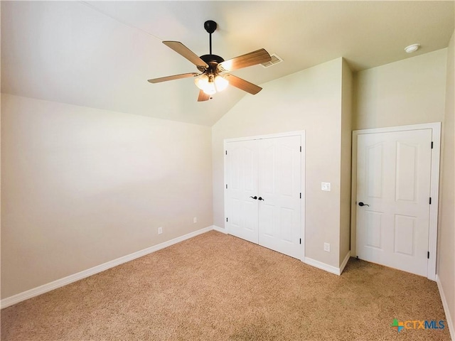 6409 Jovana Dr, Killeen, TX 76542 - unfurnished bedroom featuring vaulted ceiling, light carpet, and a ceiling fan