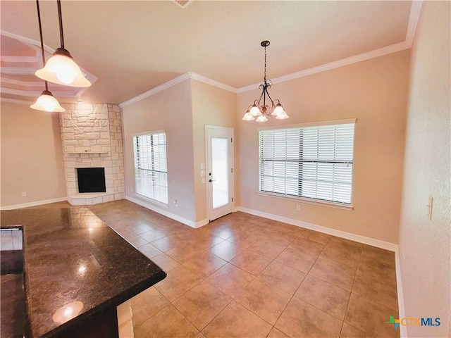 6409 Jovana Dr, Killeen, TX 76542 - foyer with light tile patterned flooring, a fireplace, crown molding, and a chandelier