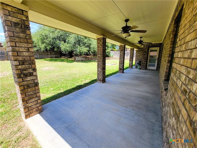 6409 Jovana Dr, Killeen, TX 76542 - fenced backyard with ceiling fan and a patio area