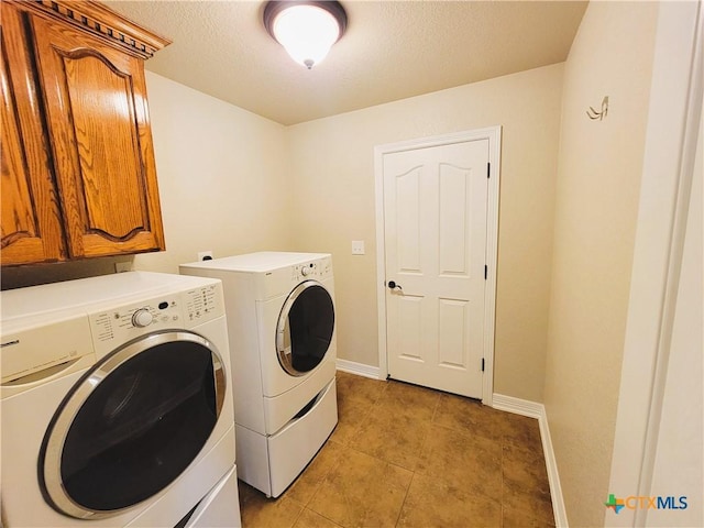 6409 Jovana Dr, Killeen, TX 76542 - washroom featuring washer and clothes dryer, cabinet space, light tile patterned floors, and a textured ceiling