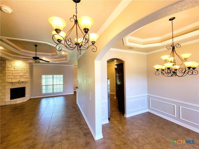 6409 Jovana Dr, Killeen, TX 76542 - unfurnished dining area featuring a raised ceiling, a chandelier, ornamental molding, arched walkways, and a ceiling fan