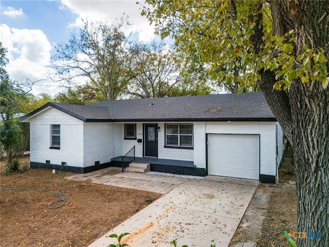 ranch-style home with a garage