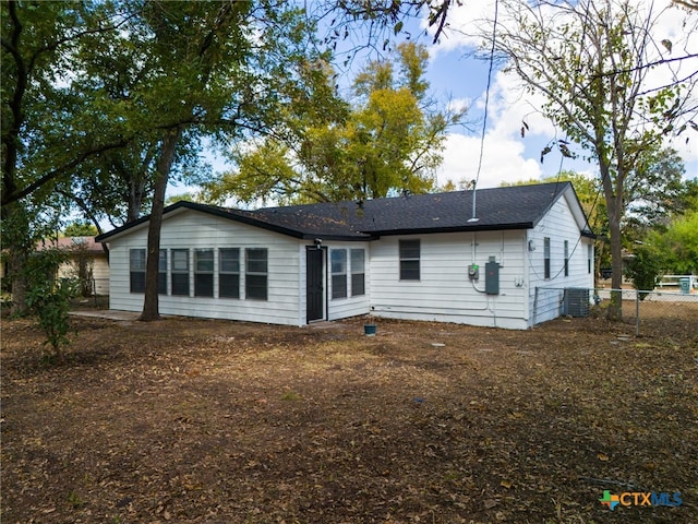 rear view of property with central AC unit