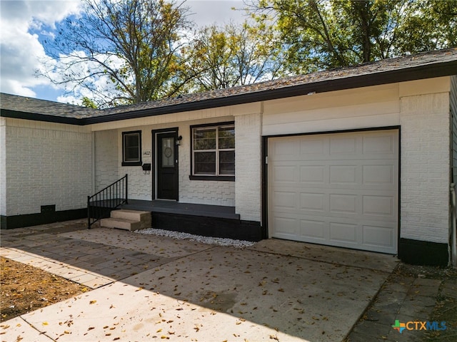 exterior space with a garage and covered porch