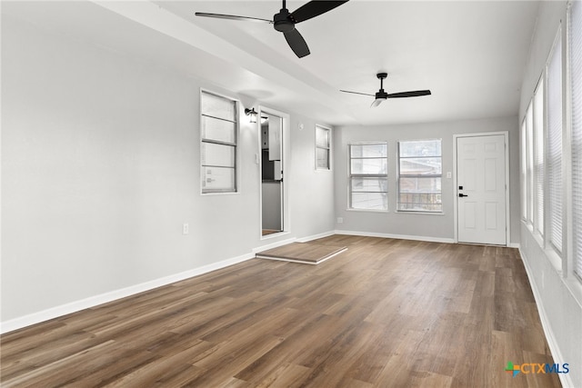 spare room featuring hardwood / wood-style flooring and ceiling fan