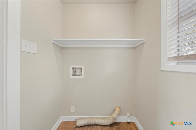 laundry area featuring hookup for a washing machine and hardwood / wood-style flooring