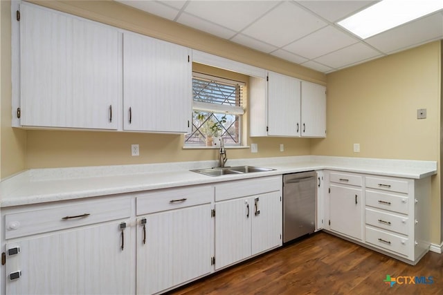 1322 Rivercrest Dr, New Braunfels, TX 78130 - kitchen featuring dishwasher, a sink, light countertops, dark wood-style floors, and a paneled ceiling