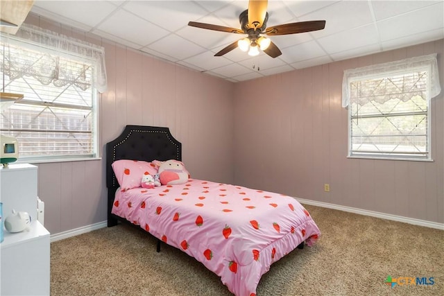 1322 Rivercrest Dr, New Braunfels, TX 78130 - carpeted bedroom with multiple windows, baseboards, a paneled ceiling, and ceiling fan